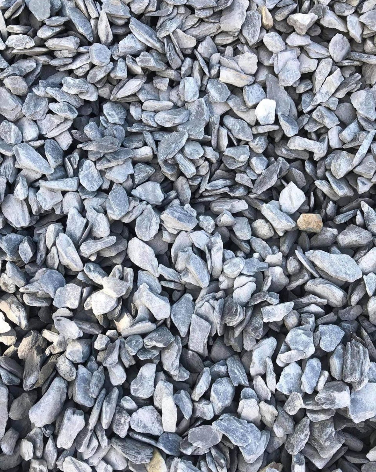 Enhance your landscape with Black Slate Stone Chips, a sleek and modern ground cover ideal for various outdoor projects. Known for their deep black color and natural texture, these stone chips provide a dramatic and refined look that complements any garden, walkway, or decorative feature. 