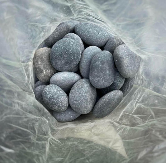 Enhance your outdoor spaces with high-quality gray rock, perfect for garden beds, pathways, and various landscape designs. This durable and long-lasting rock is versatile, ideal for edging, drainage, or decorative use. Its natural, non-polished texture provides a rustic look suitable for any outdoor project.