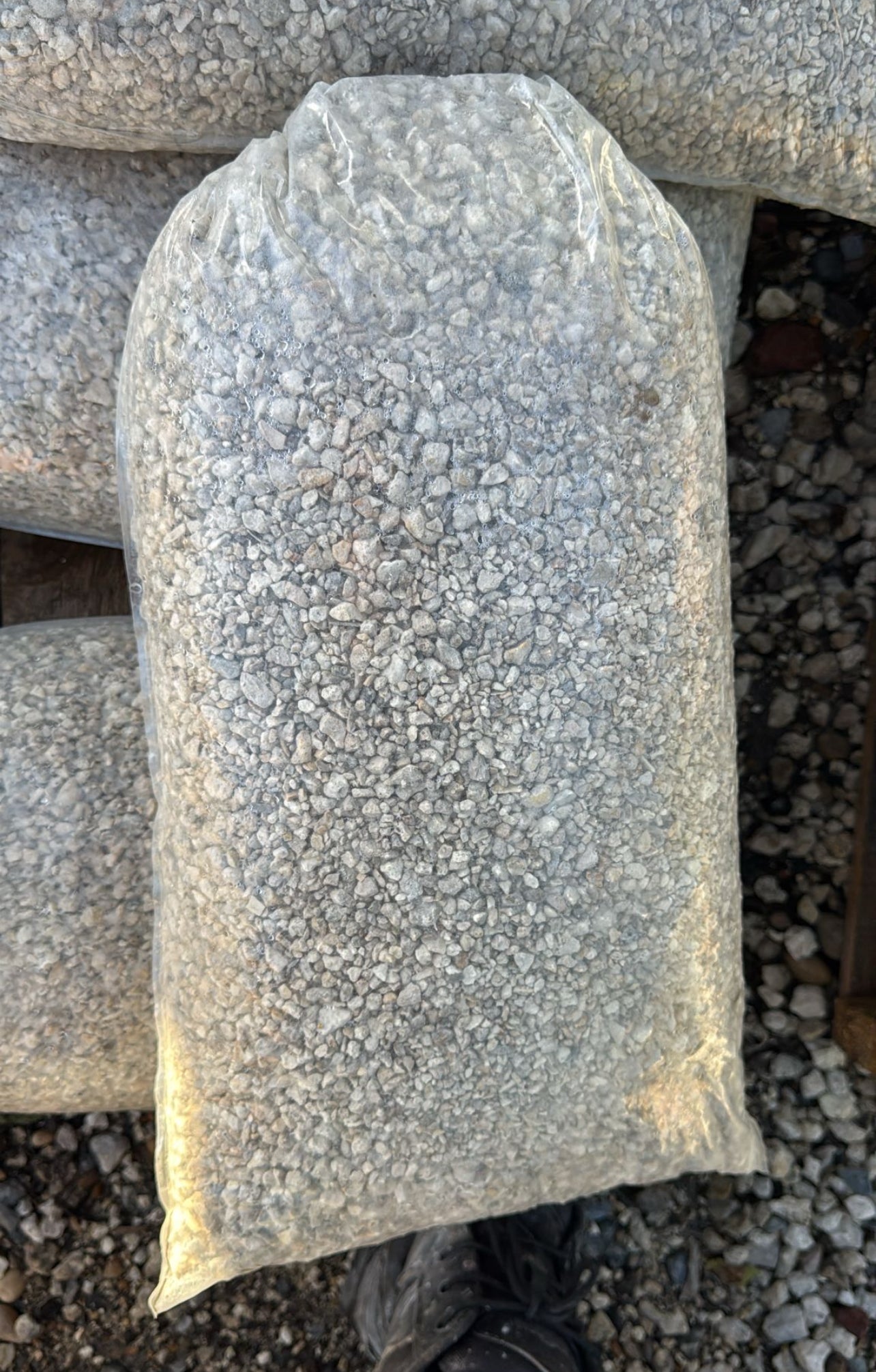 Pea Rock, also known as Pea Gravel, is a small, smooth stone commonly used in landscaping and construction projects. Known for its rounded shape and varied colors, this versatile aggregate is ideal for both decorative and functional purposes in outdoor settings.