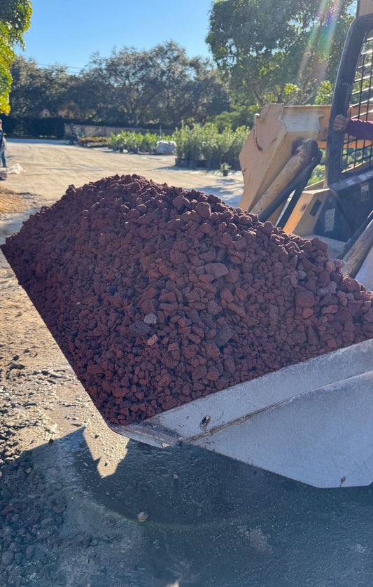Give your landscape a unique edge with Red Lava Rock, featuring rich, natural red tones that add warmth and contrast to any outdoor space. Known for its porous, lightweight structure, this rock is a versatile choice for decorative ground cover, moisture retention, and erosion control. 