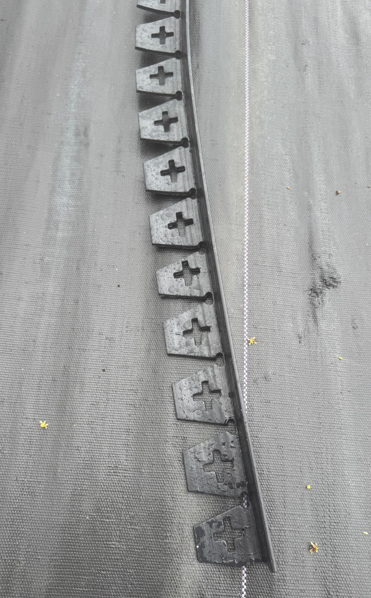 This 15-foot edging system anchors easily with stakes, keeping hardscape elements in place for a clean, professional look. Ideal for walkways, patios, and garden edges, this flexible border can be cut to size to fit any project.