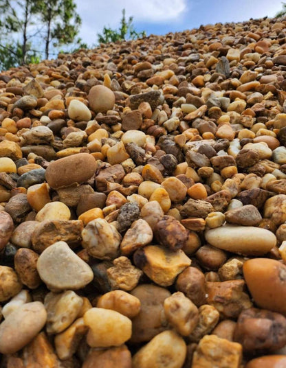 These smooth, rounded stones are ideal for garden beds, walkways, patios, and as decorative accents around ponds or fountains. Perfect for erosion control and drainage areas, Brown River Rock is durable, low-maintenance, and versatile, giving any landscape design a polished, natural look.